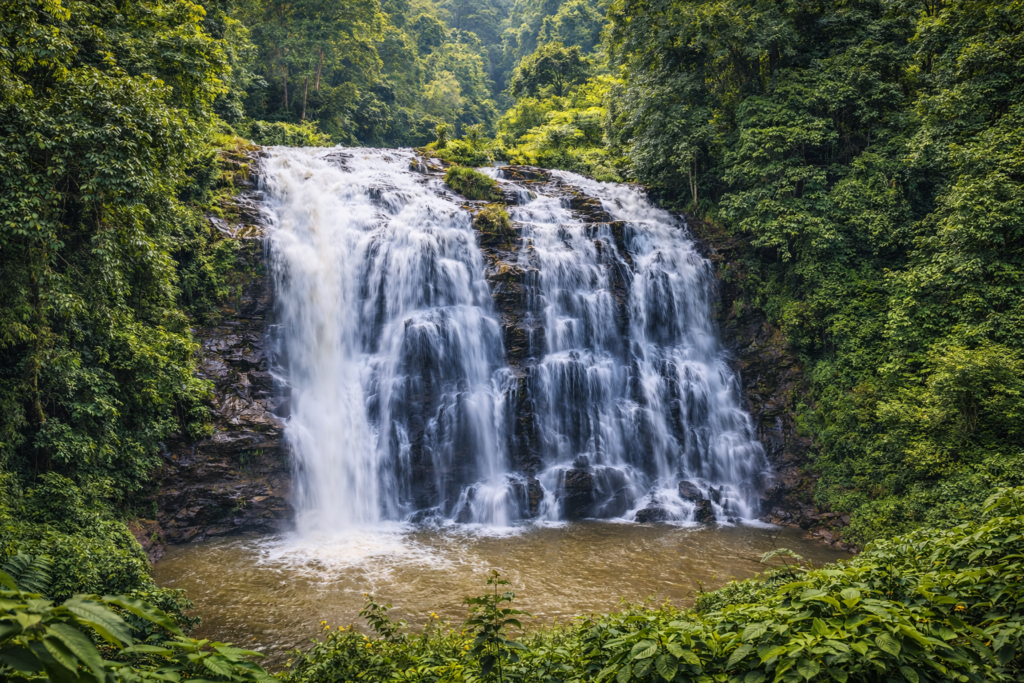 Abbey Falls Coorg amid lush greenery, one of the popular Coorg sightseeing places